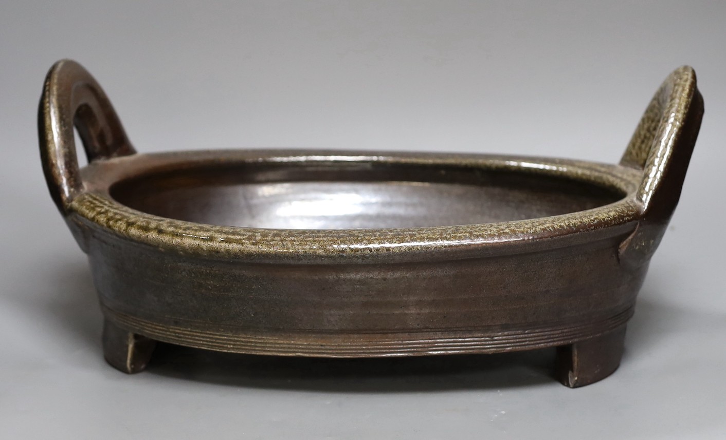 A large studio pottery grey salt glazed stoneware two handled dish, unmarked, 36cm wide